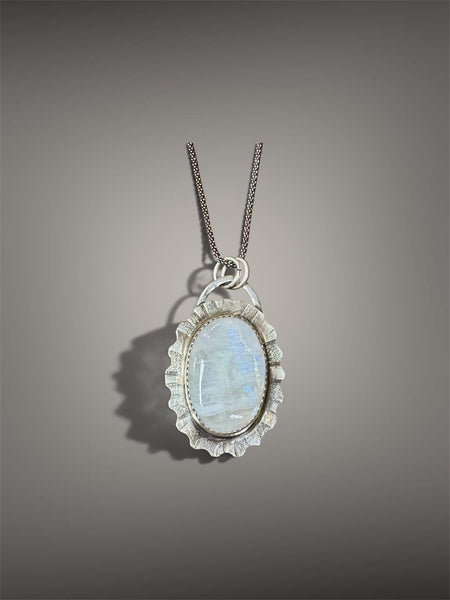 Rainbow moonstone and silver pendant