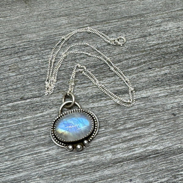 Rainbow moonstone and silver pendant