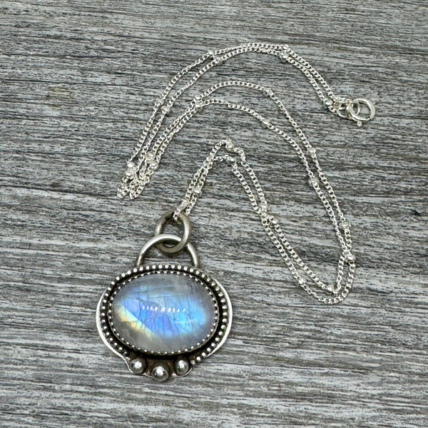 Rainbow moonstone and silver pendant