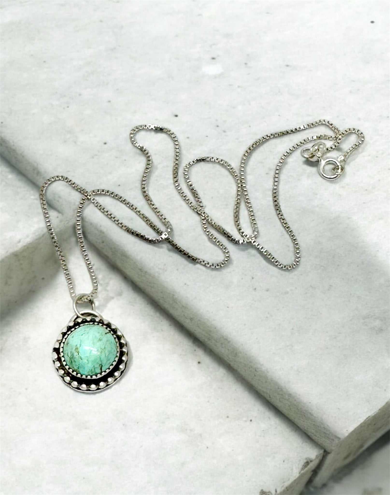 Turquoise Mountain silver pendant