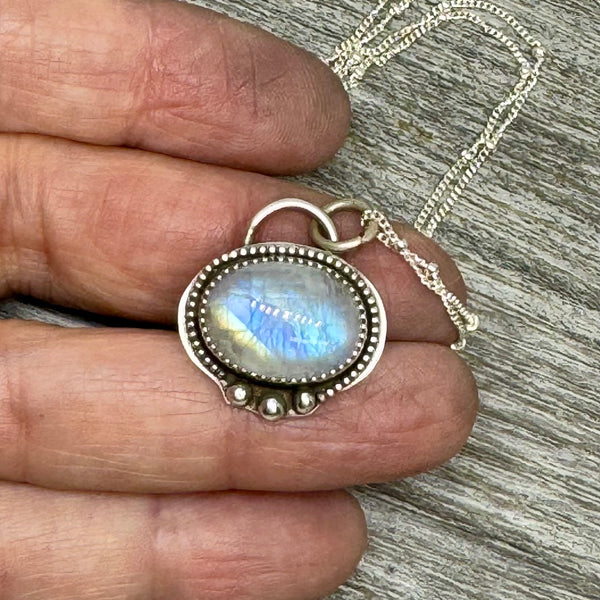 Rainbow moonstone and silver pendant