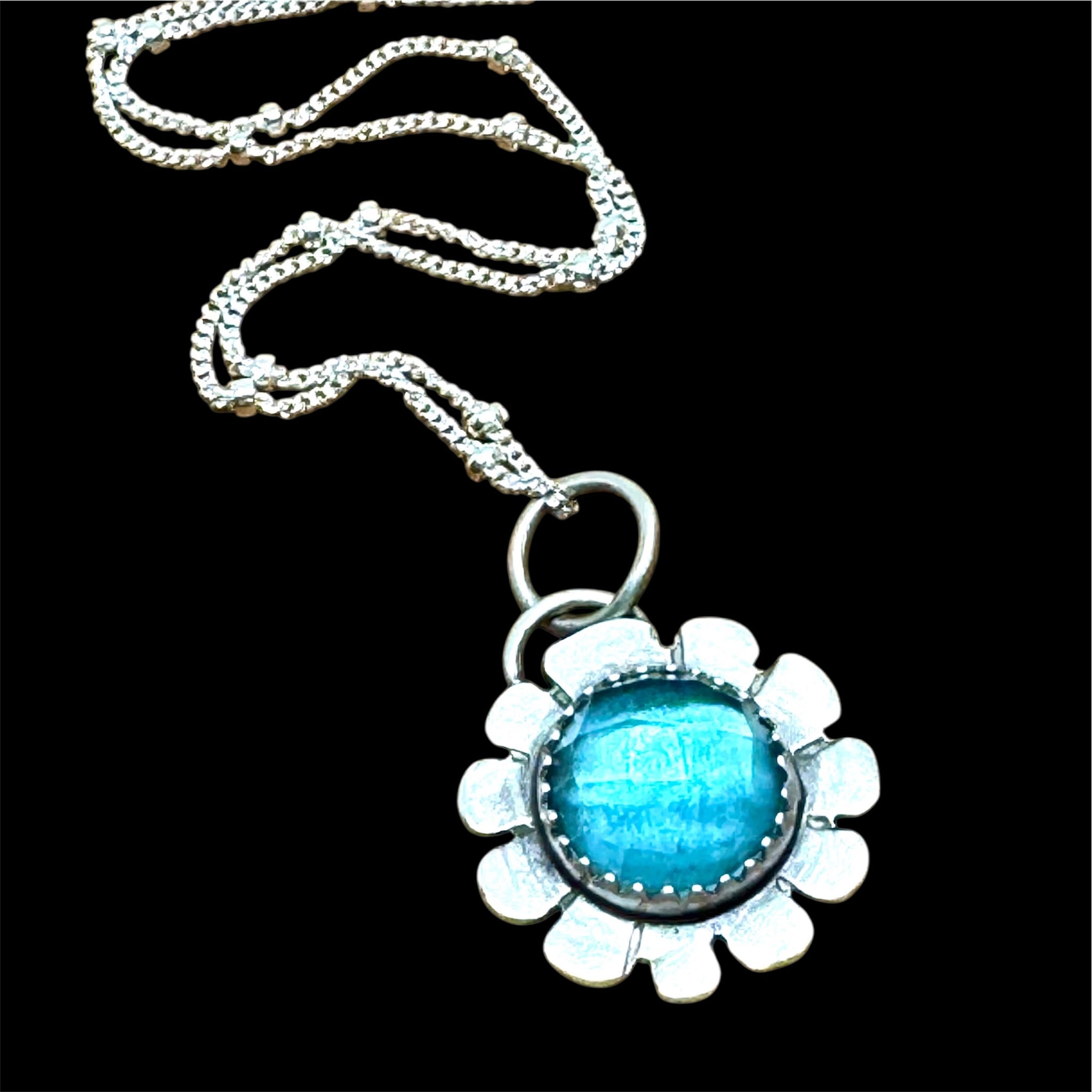 Blue topaz flower pendant