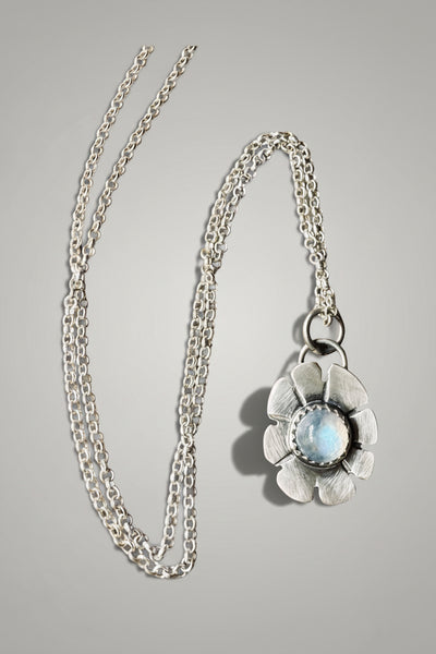 Tiny moonstone flower pendant