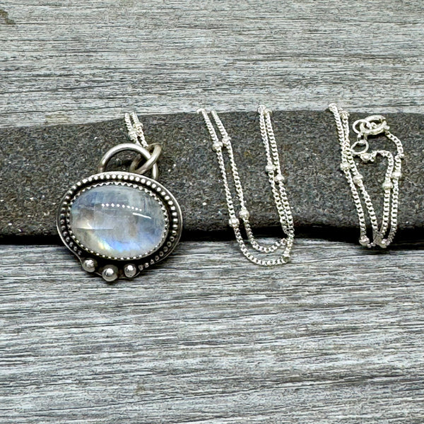 Rainbow moonstone and silver pendant