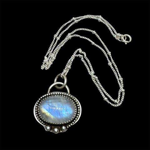 Rainbow moonstone and silver pendant