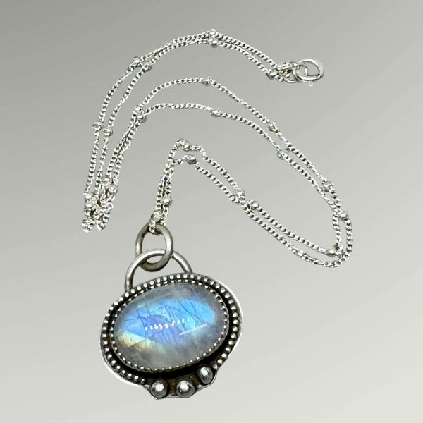 Rainbow moonstone and silver pendant